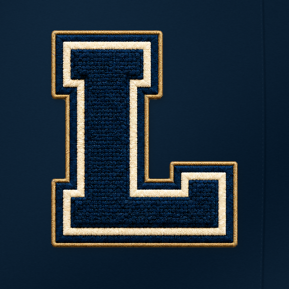 Letterman Standard navy chenille varsity L with cream and gold stitched edging against navy fabric.